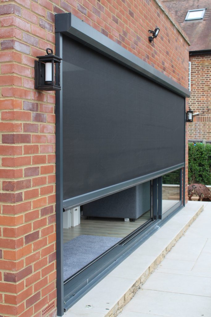 Automated solar screen closing on a large sliding door